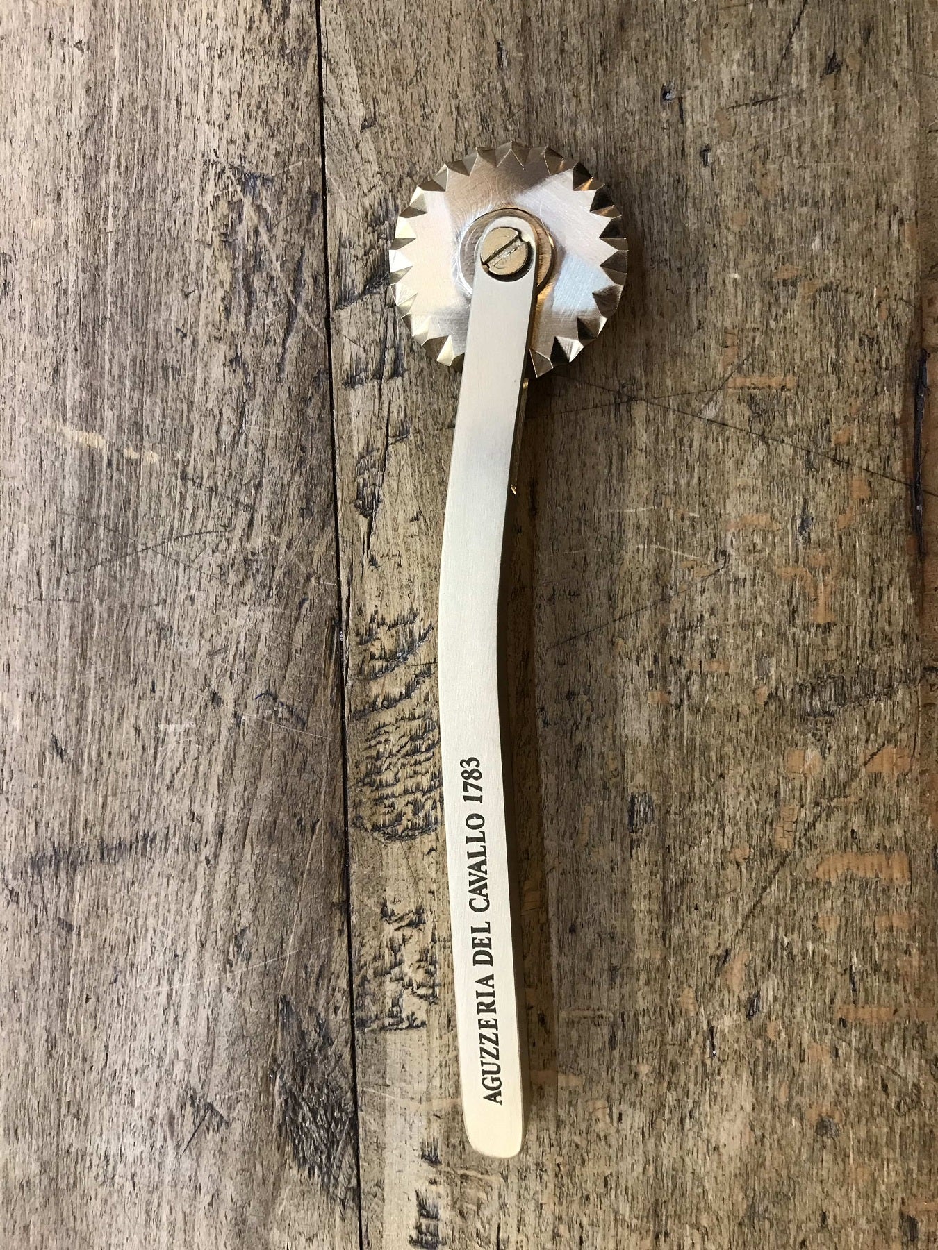 Festooned brass spur - Dough wheel