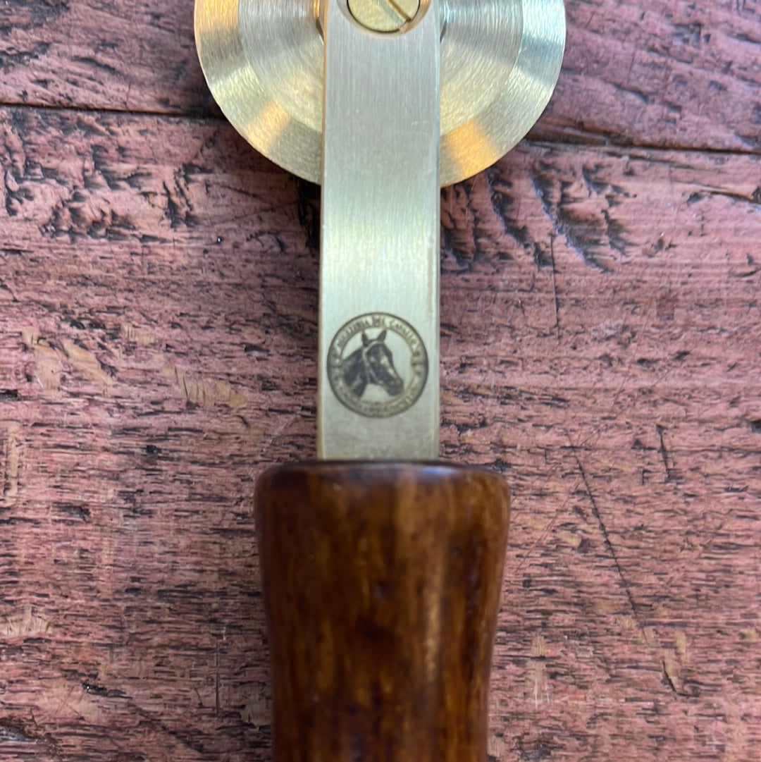 Brass spur with smooth wooden handle